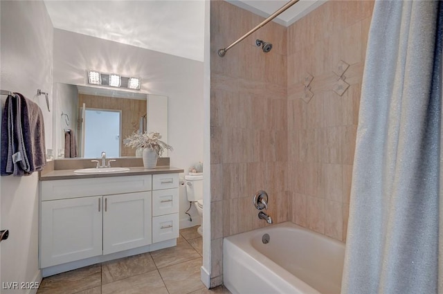 full bathroom featuring tile patterned floors, shower / bath combo, toilet, and vanity