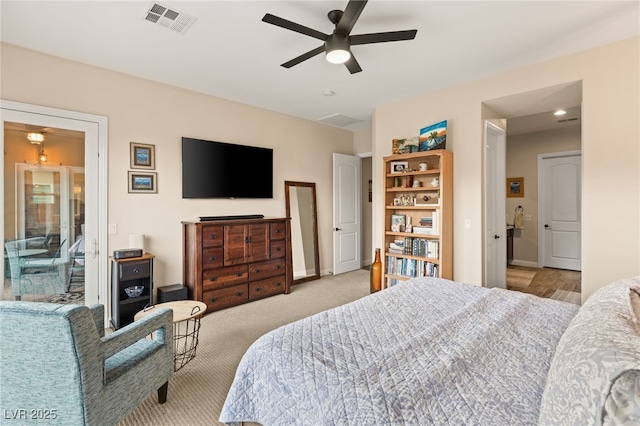 carpeted bedroom with ceiling fan