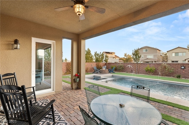 view of patio with pool water feature, ceiling fan, and a pool with hot tub