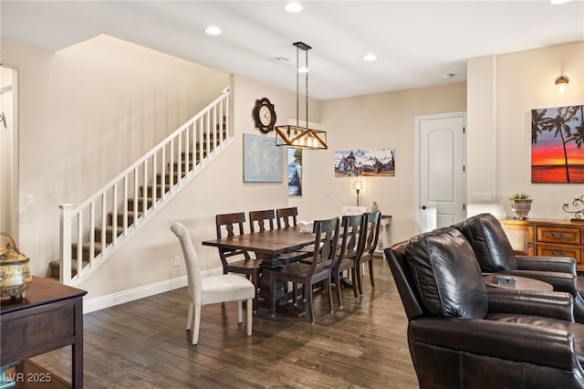 dining area with dark hardwood / wood-style floors