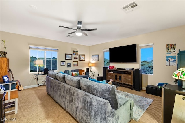 living room with ceiling fan and light carpet