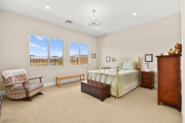 carpeted bedroom featuring a notable chandelier