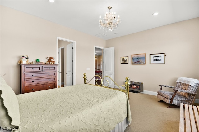 carpeted bedroom with an inviting chandelier