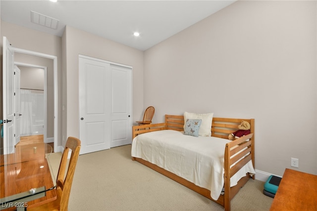 bedroom with a closet and carpet floors