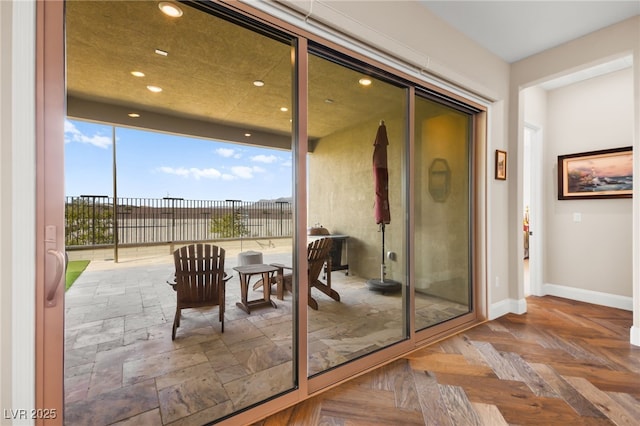 doorway with parquet flooring