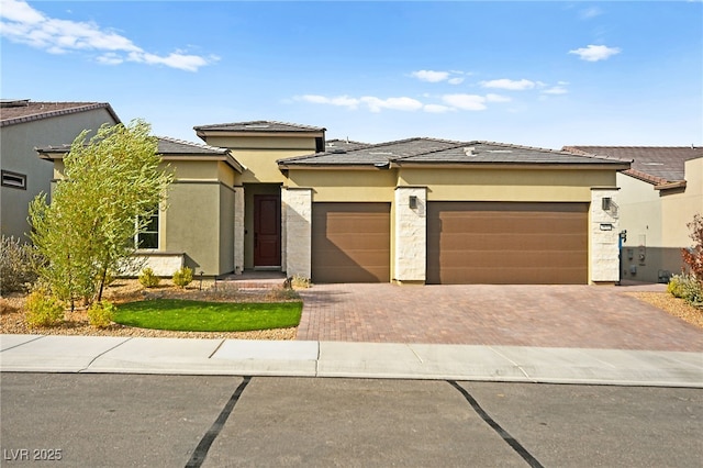 prairie-style house featuring a garage