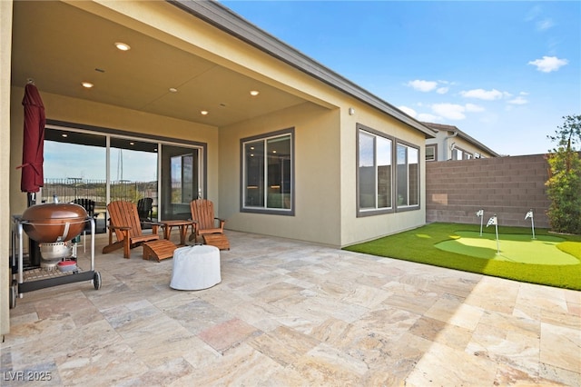 view of patio featuring a grill