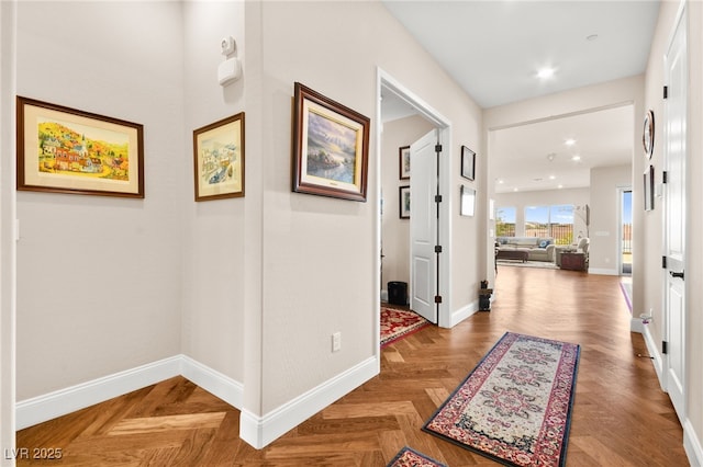 hall featuring parquet flooring