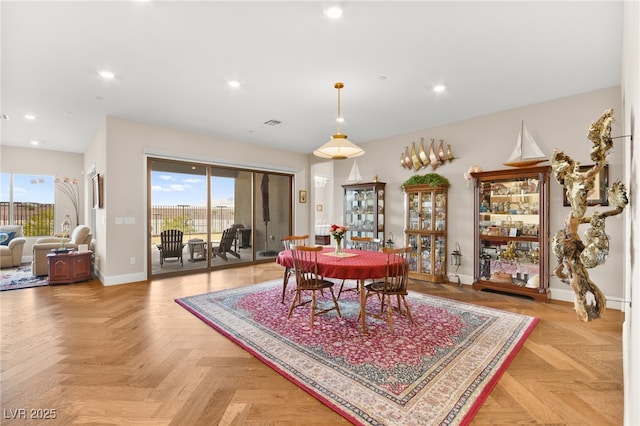 dining space with light parquet flooring