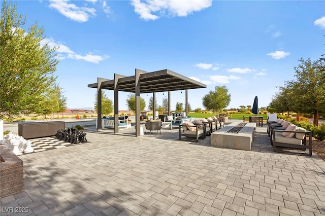 view of patio / terrace with an outdoor living space with a fire pit