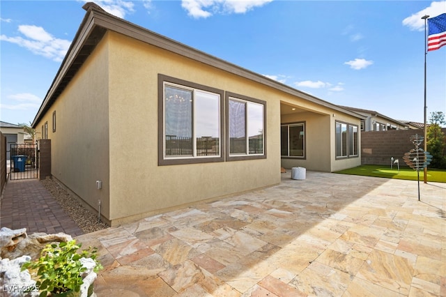 back of house with a patio