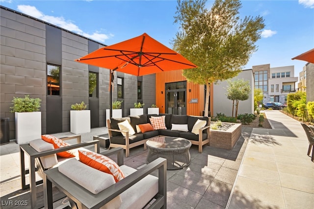 view of patio featuring french doors and an outdoor living space with a fire pit