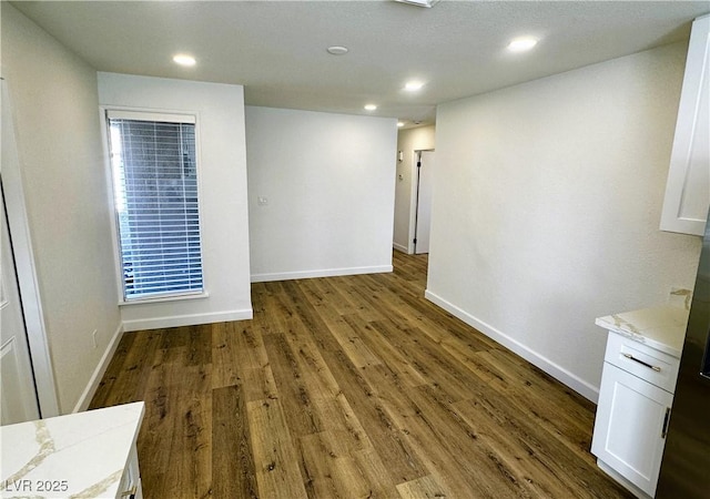 unfurnished room featuring dark hardwood / wood-style flooring