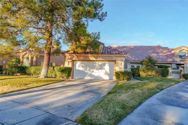 view of front of home with a front lawn and a garage