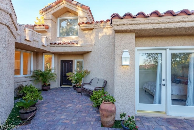 doorway to property featuring a patio