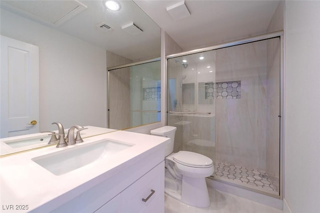 bathroom featuring toilet, vanity, and an enclosed shower