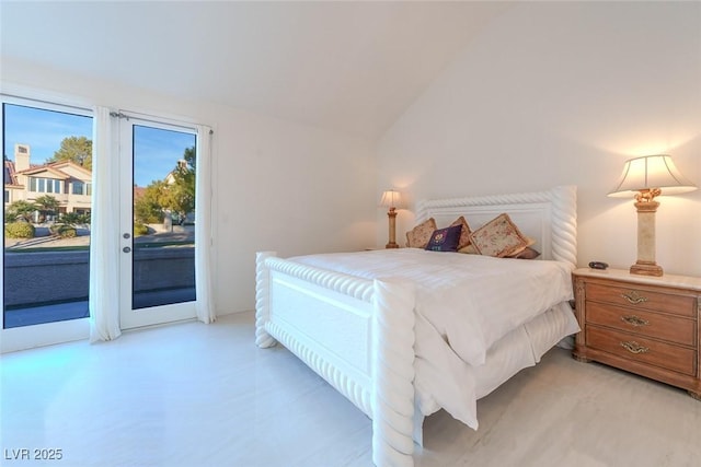 bedroom featuring access to exterior and vaulted ceiling