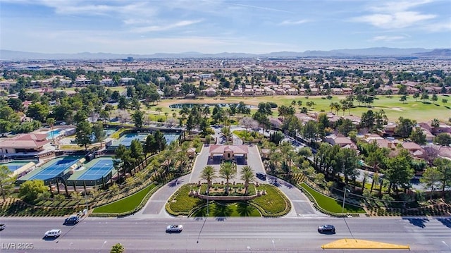 birds eye view of property with a mountain view