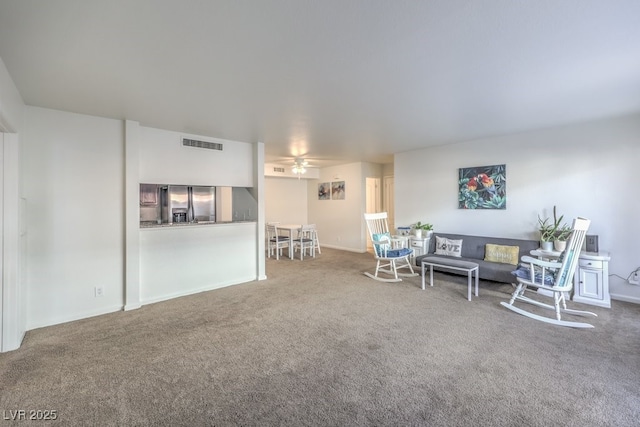 living room with carpet floors and ceiling fan