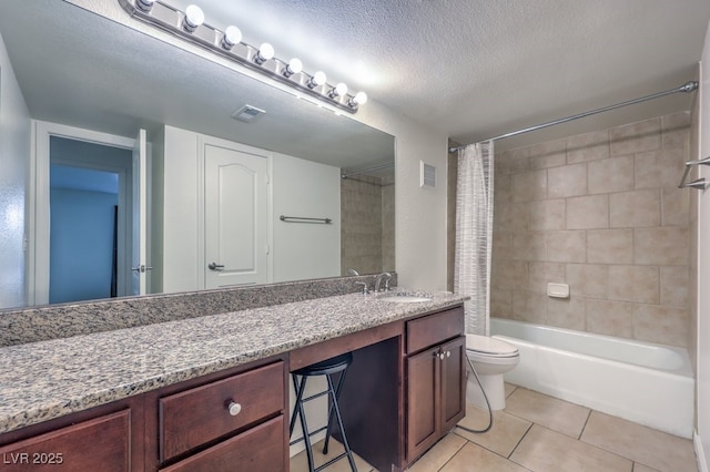 full bathroom featuring shower / bath combo, vanity, tile patterned flooring, toilet, and a textured ceiling