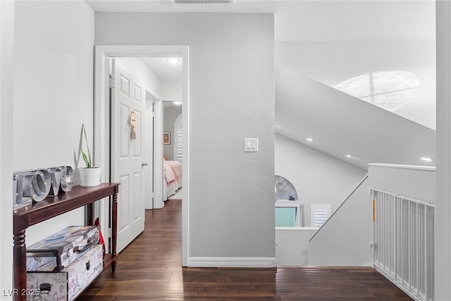 corridor featuring dark hardwood / wood-style flooring