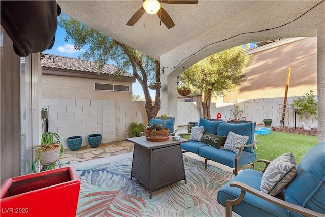 view of patio featuring ceiling fan and an outdoor living space