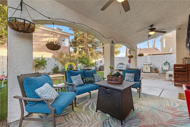 view of patio / terrace featuring ceiling fan and an outdoor living space