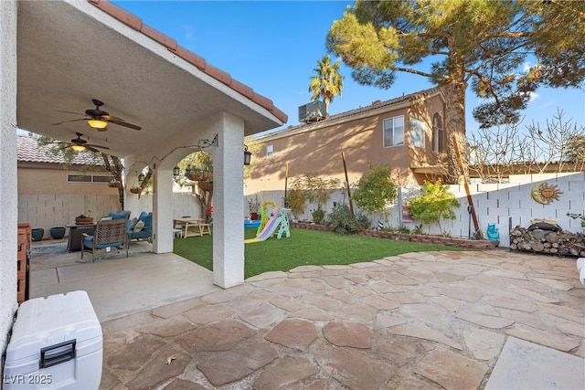 view of patio featuring ceiling fan