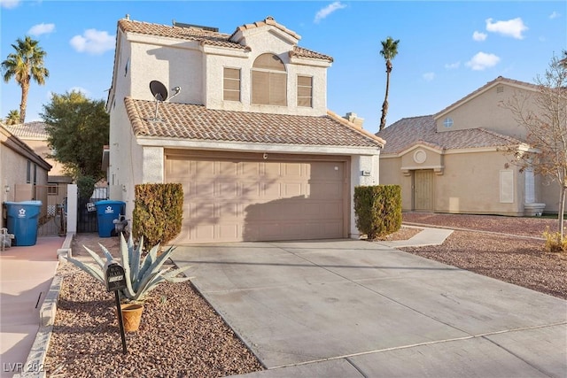 mediterranean / spanish-style house featuring a garage