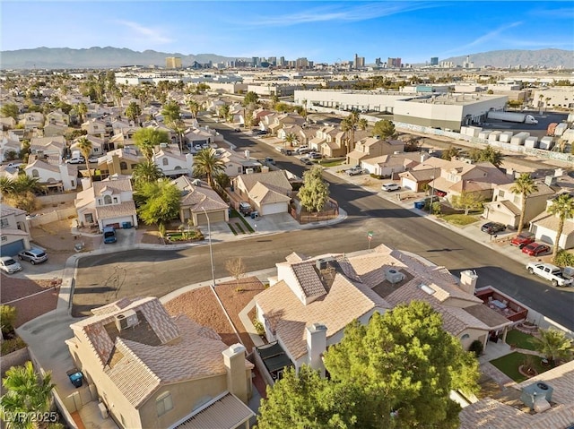 birds eye view of property with a mountain view