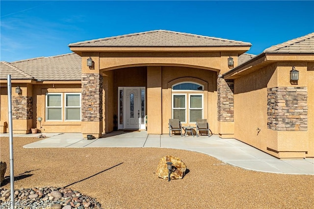 back of property featuring a patio