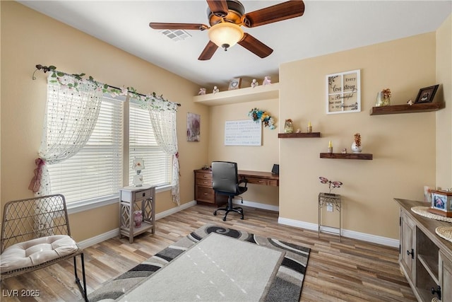 office area featuring ceiling fan and light hardwood / wood-style floors