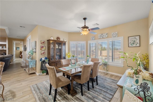 dining area with ceiling fan and light hardwood / wood-style floors