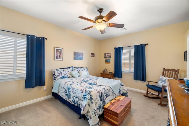 bedroom with light colored carpet and ceiling fan