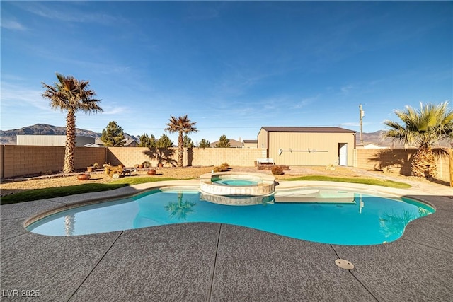 view of pool with an in ground hot tub