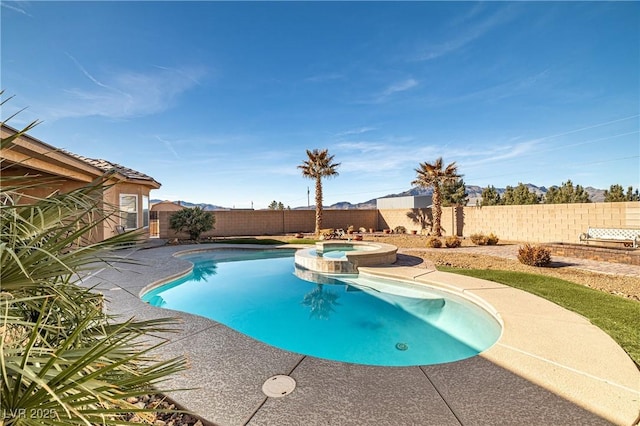 view of pool with an in ground hot tub