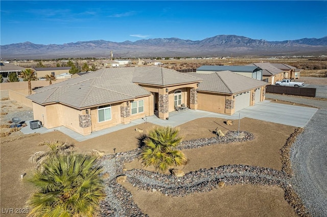 birds eye view of property with a mountain view