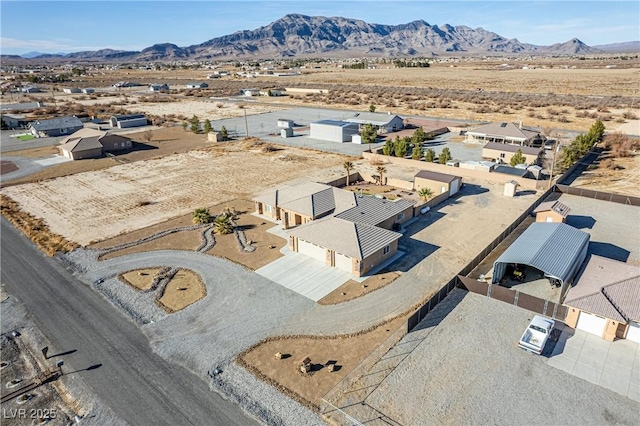 drone / aerial view featuring a mountain view