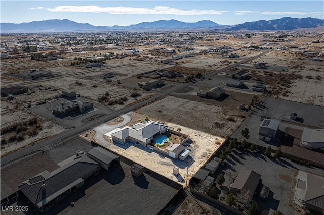 birds eye view of property featuring a mountain view