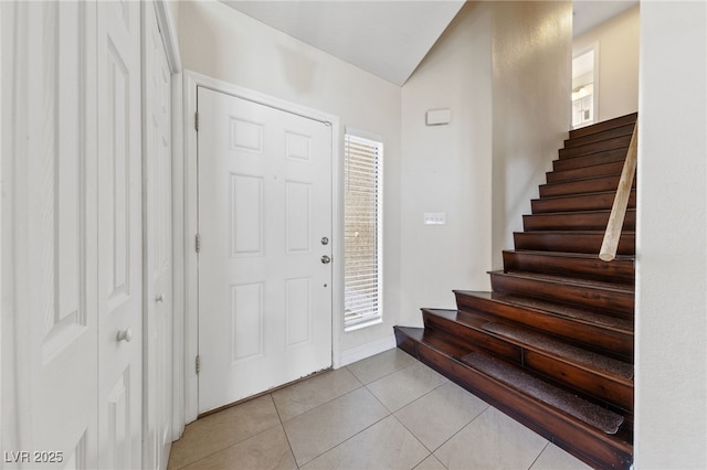 foyer entrance with light tile patterned floors