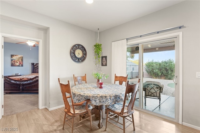 dining room with light wood-type flooring and ceiling fan