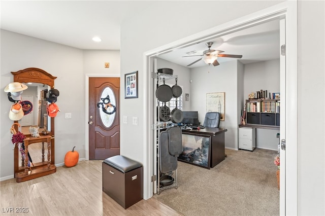 entryway featuring ceiling fan and light hardwood / wood-style flooring