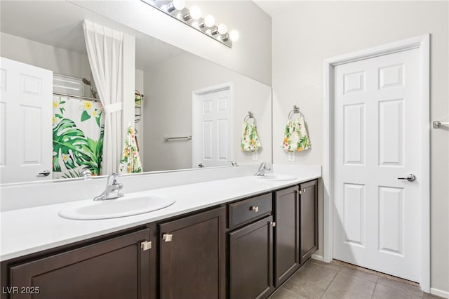 bathroom with tile patterned flooring and vanity