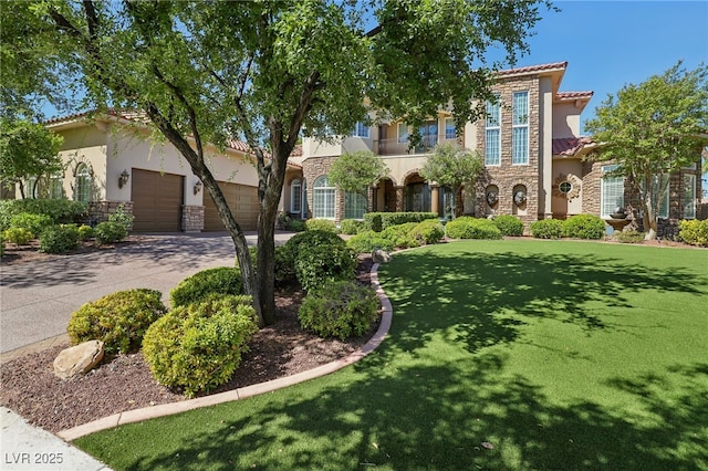 mediterranean / spanish-style house with a garage