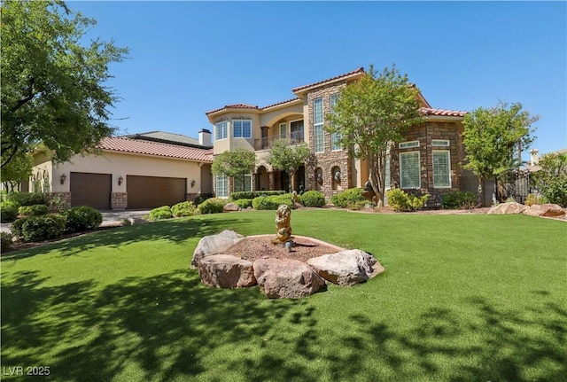 mediterranean / spanish home featuring a garage and a front yard