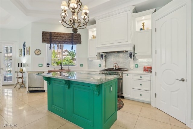 kitchen with white cabinets, appliances with stainless steel finishes, and a center island