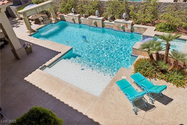 view of swimming pool featuring pool water feature