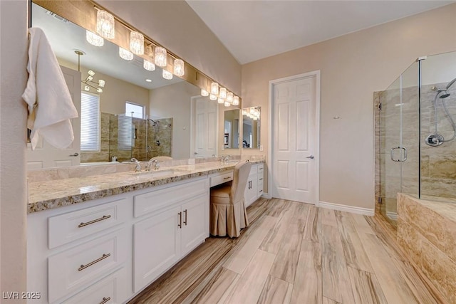 bathroom featuring vanity, wood-type flooring, and walk in shower