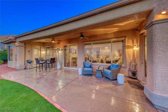 view of patio with outdoor lounge area and ceiling fan