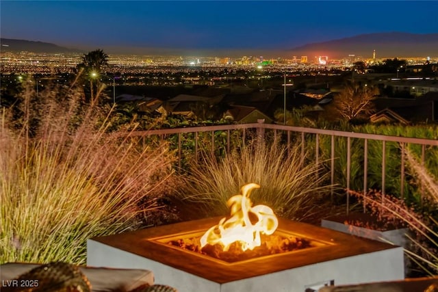 balcony at dusk with a fire pit